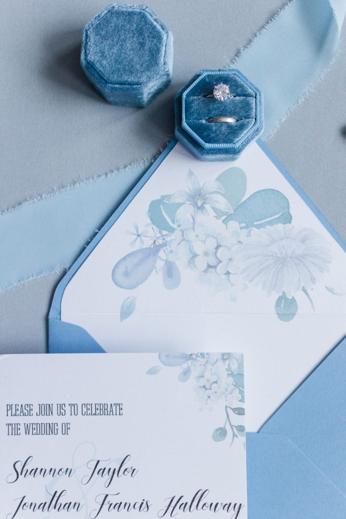 Blue watercolor invitation with ring and envelope liner embellishment.