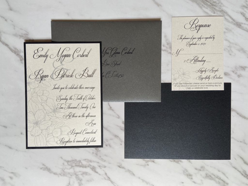 Black and white formal wedding invitation suite. Black envelope with black printed addresses.