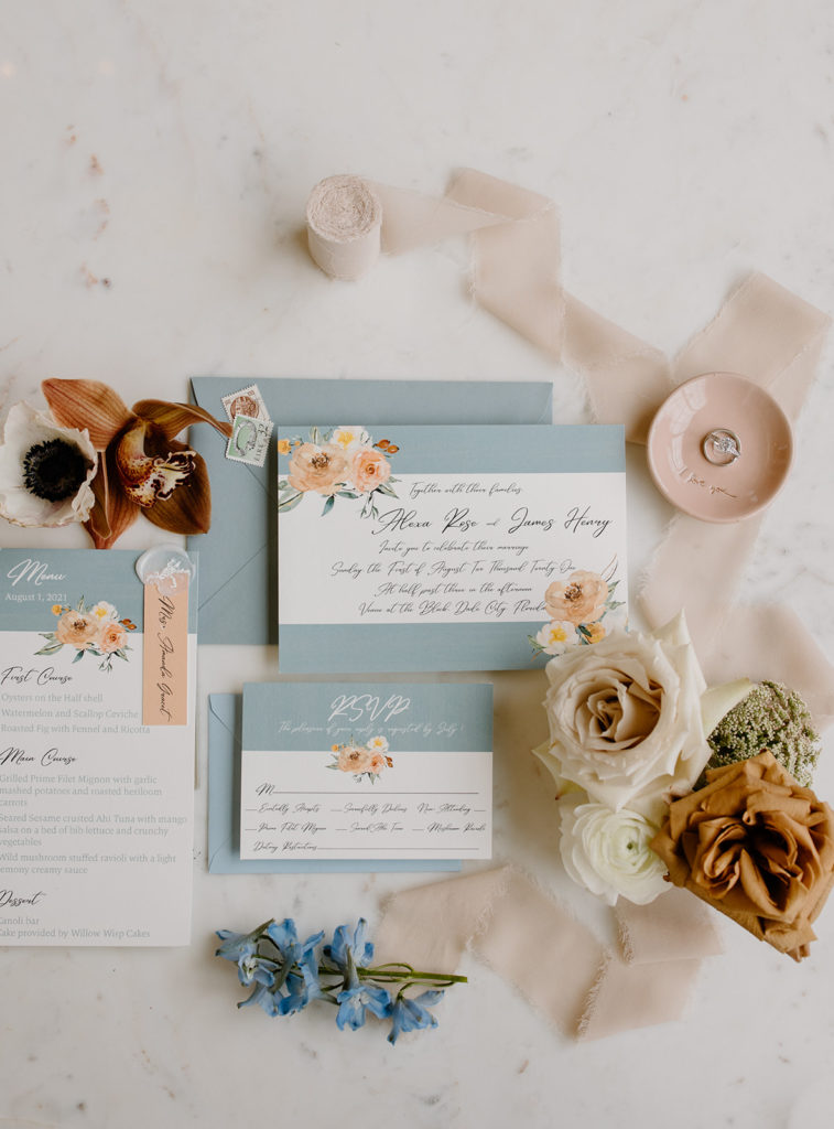 pastel blue and pink wedding stationery set with modern rustic florals.