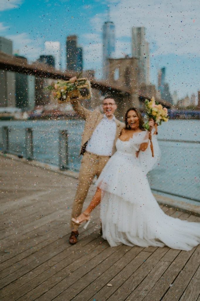 Fun wedding photo of couple with glitter. 