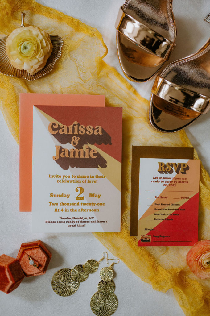 70s retro themed wedding invitation with bright red and oranges based on the 2021 trends.