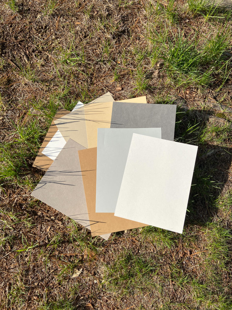 Collection of recycled stationery paper in a variety of nature-inspired colors.