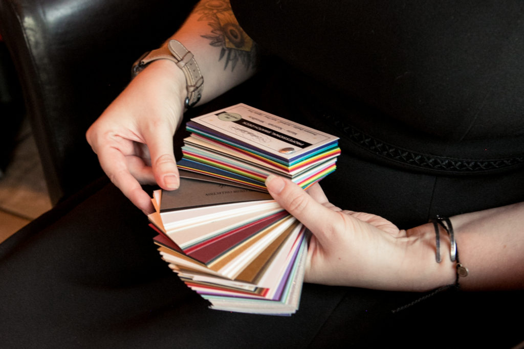 A book of colored paper samples used to create a color palette. 