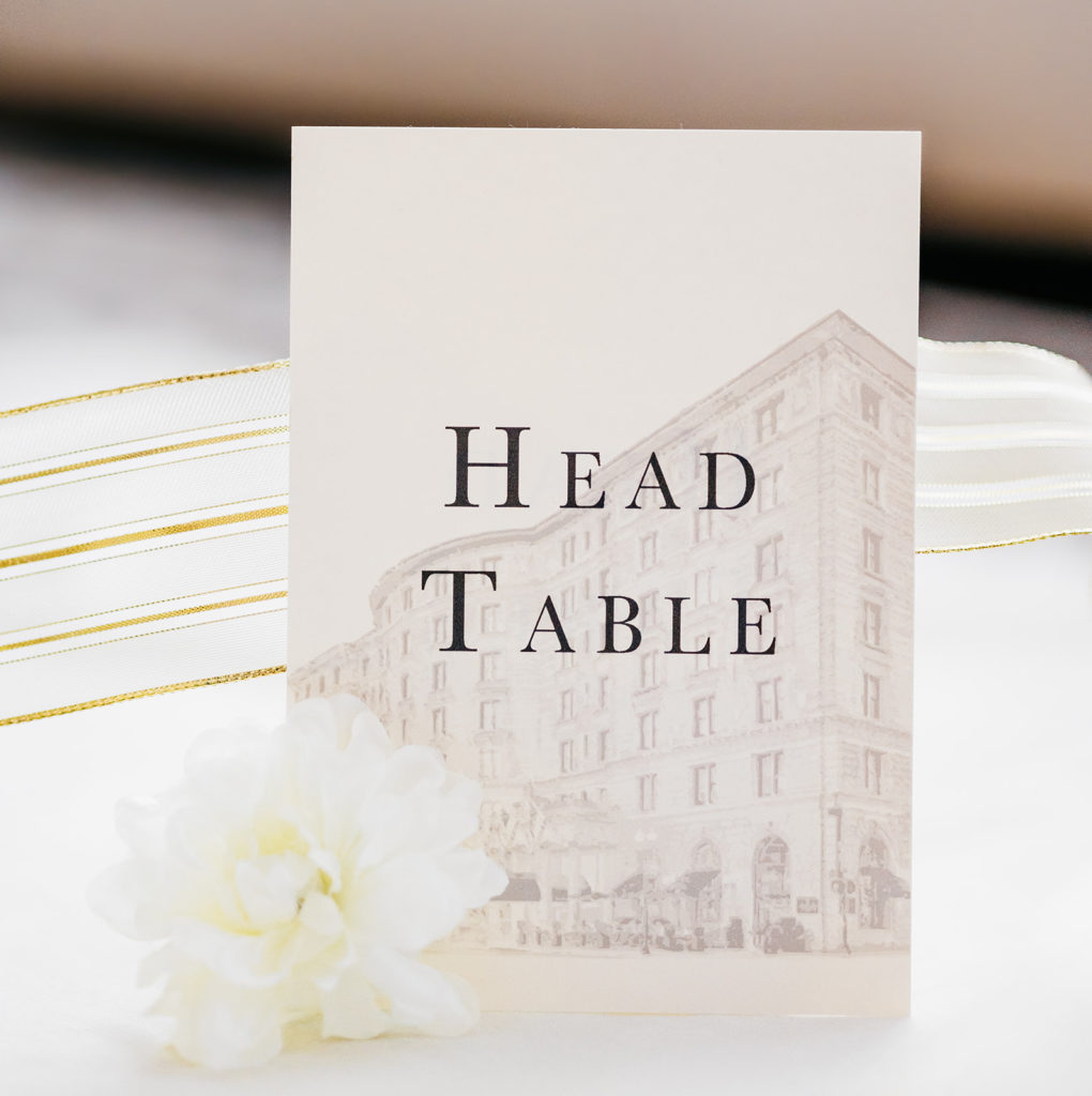 Wedding day stationery table number. Head table sign with architecture motif.