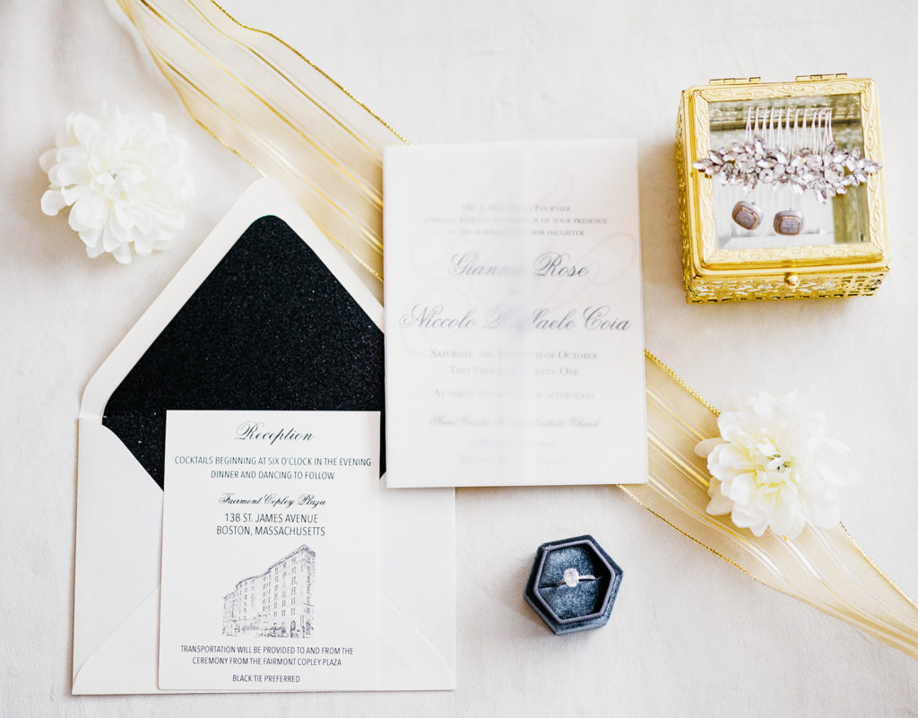 Wedding invitations with architecture motif that matches the illustration on the table sign.