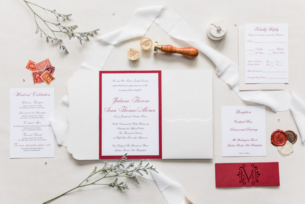 Wedding stationery suite, including invitation, pocket envelope, RSVP card, details card, and belly band. 